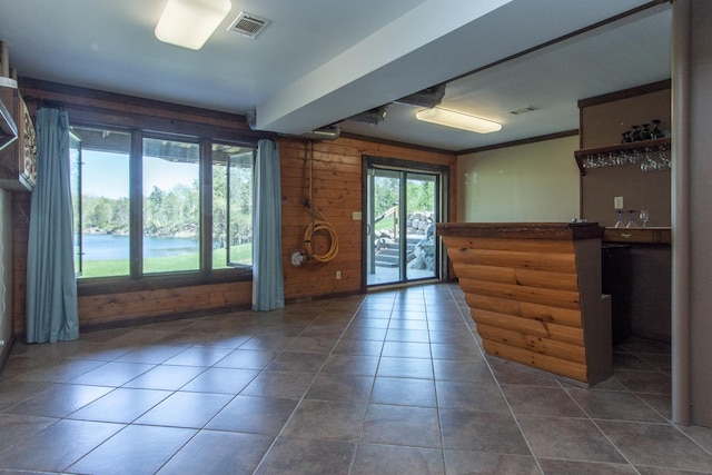 24341 Bluebird Ave, Trommald, MN 56441 - foyer entrance featuring tile patterned floors, wood walls, and bar
