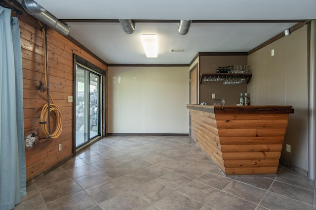24341 Bluebird Ave, Trommald, MN 56441 - indoor dry bar with wooden walls, ornamental molding, and tile patterned flooring