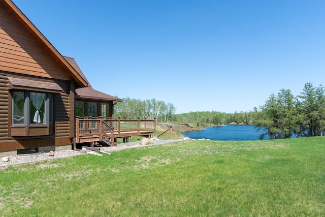 24341 Bluebird Ave, Trommald, MN 56441 - view of grassy yard featuring a deck with water view