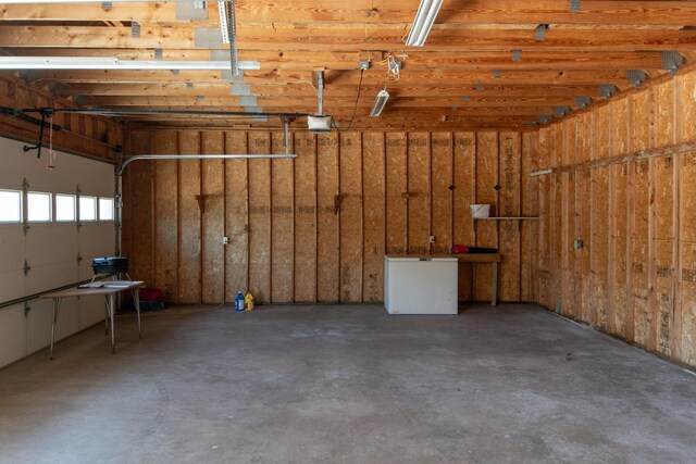 24341 Bluebird Ave, Trommald, MN 56441 - garage with white fridge