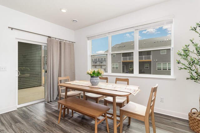 dining space featuring recessed lighting, baseboards, and dark wood-type flooring