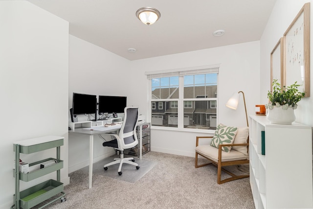 carpeted office space with baseboards