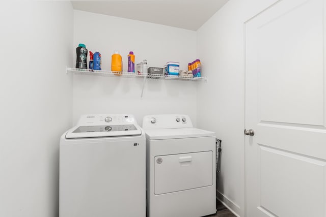 washroom with separate washer and dryer and laundry area