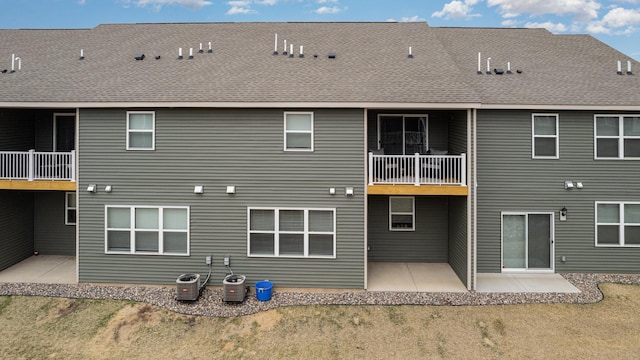back of house featuring a patio area and a balcony