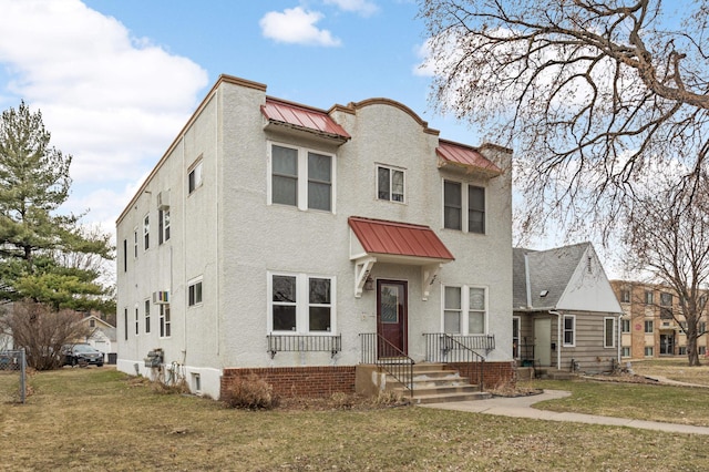 4348 Minnehaha Ave, Minneapolis, MN 55406 - view of property with a standing seam roof, a front lawn, metal roof, and stucco siding