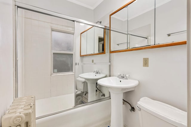 4348 Minnehaha Ave, Minneapolis, MN 55406 - full bathroom featuring radiator, toilet, crown molding, shower / bath combination, and a sink