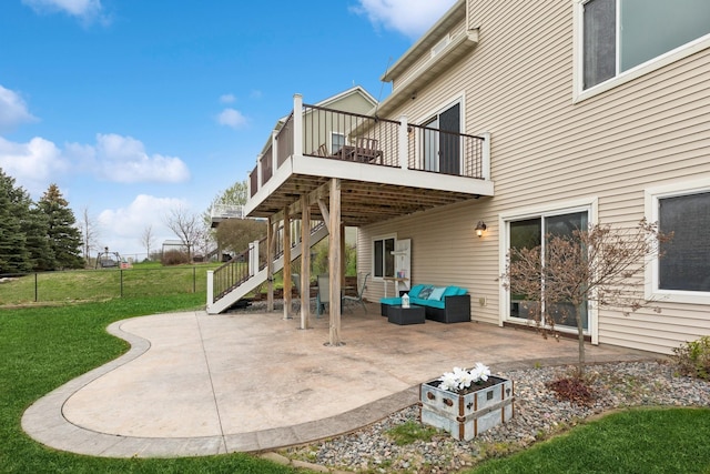 view of patio / terrace featuring stairs, an outdoor living space, and a deck