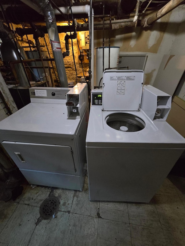 washroom featuring separate washer and dryer and laundry area