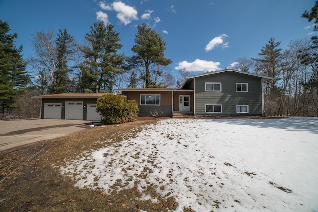 split level home featuring a garage and driveway