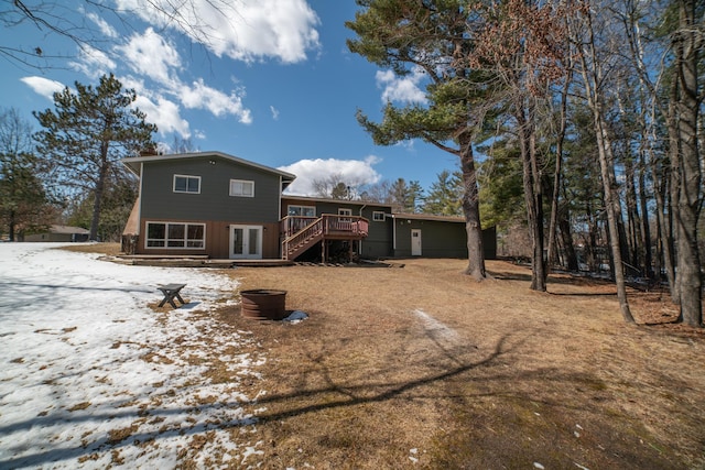 back of property featuring stairway, french doors, and a wooden deck
