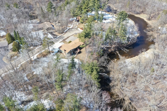 birds eye view of property featuring a forest view
