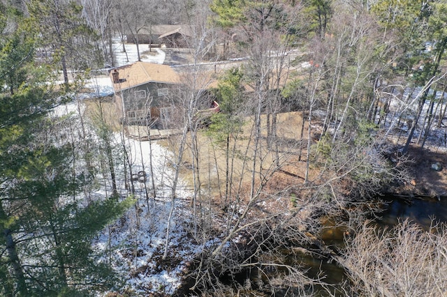 birds eye view of property with a wooded view