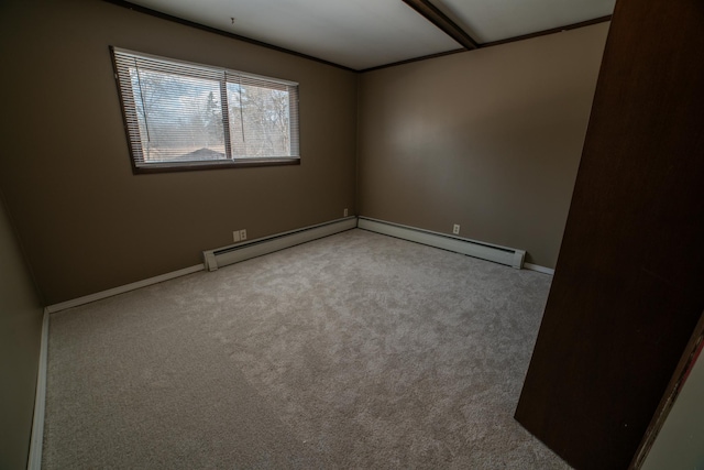 carpeted empty room featuring baseboards and a baseboard heating unit