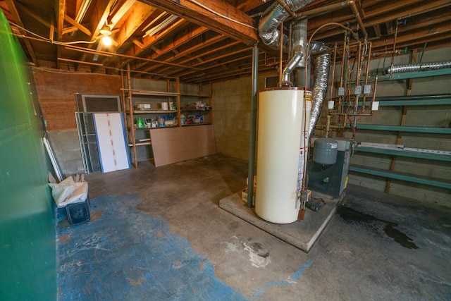 unfinished basement with concrete block wall and water heater