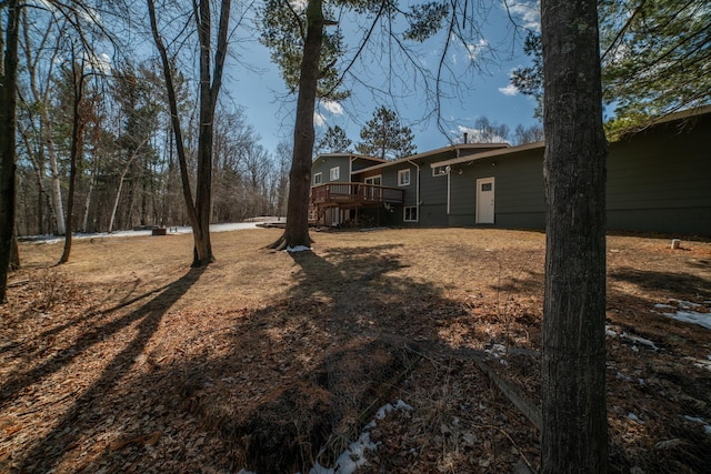 view of yard featuring stairway and a deck