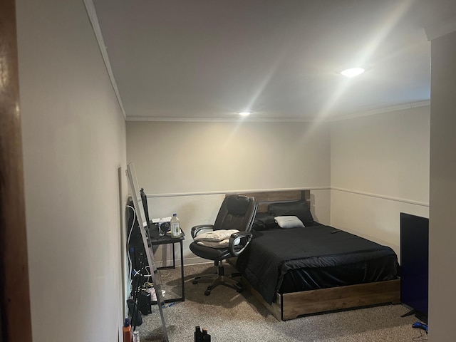 carpeted bedroom featuring crown molding
