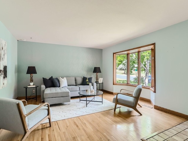 living room featuring baseboards and wood finished floors