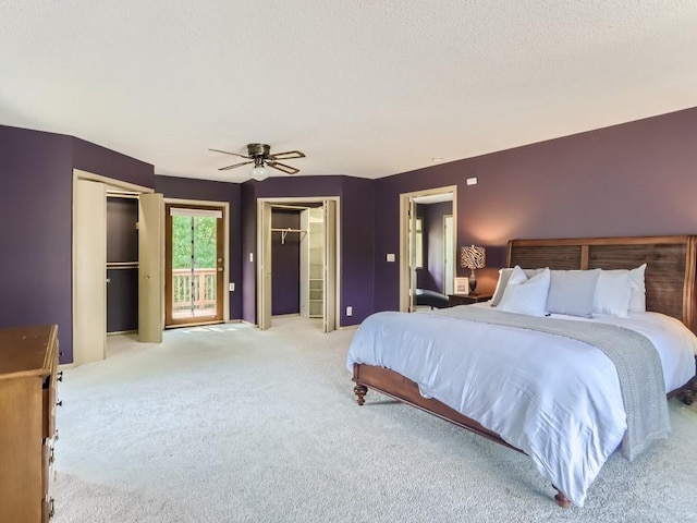 bedroom with a ceiling fan, light colored carpet, and access to exterior