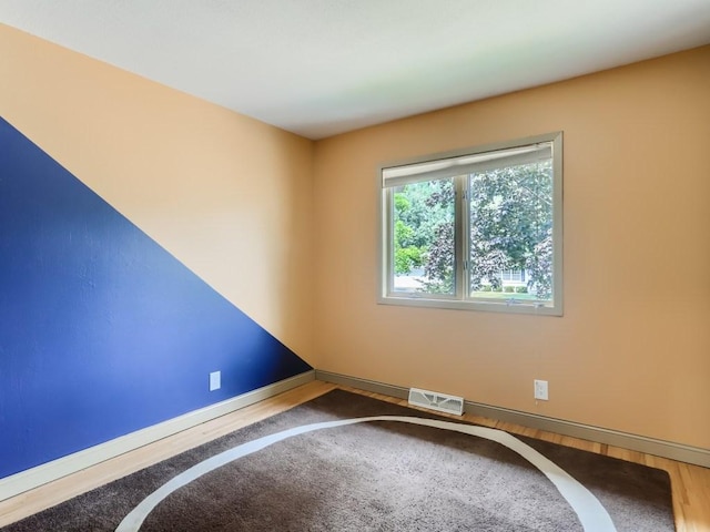 interior space with baseboards and visible vents