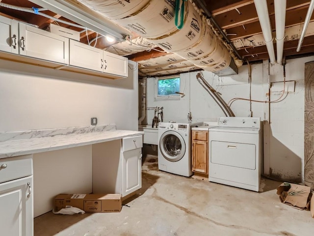 laundry area featuring cabinet space and washing machine and clothes dryer