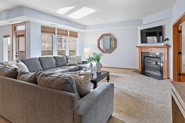 7100 Metro Blvd Unit 206, Edina, MN 55439 - carpeted living room featuring baseboards and a fireplace with flush hearth