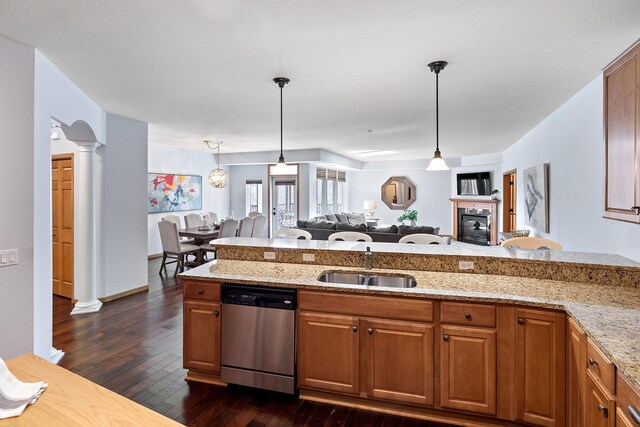7100 Metro Blvd Unit 206, Edina, MN 55439 - kitchen featuring brown cabinets, open floor plan, a sink, and dishwasher