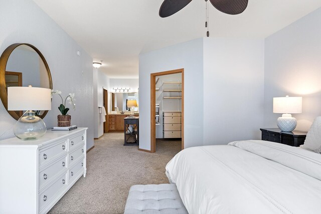 7100 Metro Blvd Unit 206, Edina, MN 55439 - bedroom featuring light colored carpet, ensuite bath, a ceiling fan, a spacious closet, and a closet