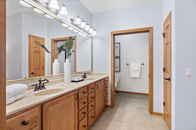 7100 Metro Blvd Unit 206, Edina, MN 55439 - bathroom with double vanity, a sink, tile patterned floors, and toilet