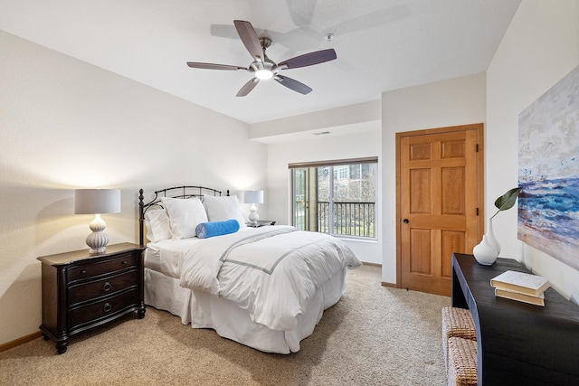 7100 Metro Blvd Unit 206, Edina, MN 55439 - bedroom with baseboards, ceiling fan, and light carpet