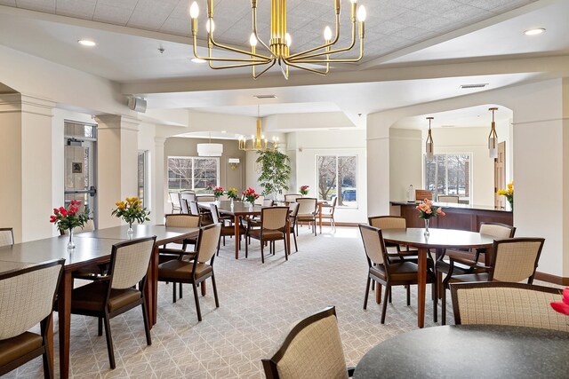 7100 Metro Blvd Unit 206, Edina, MN 55439 - dining area featuring visible vents, decorative columns, light carpet, recessed lighting, and a chandelier