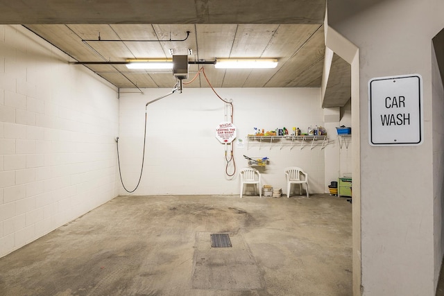 7100 Metro Blvd Unit 206, Edina, MN 55439 - garage featuring concrete block wall and a garage door opener