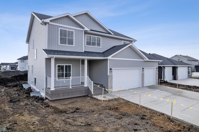 3187 Archer Pl S, Fargo, ND 58104 - view of front facade featuring a porch, an attached garage, a shingled roof, driveway, and board and batten siding
