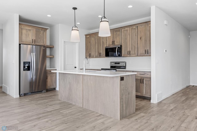 3187 Archer Pl S, Fargo, ND 58104 - kitchen featuring appliances with stainless steel finishes, a sink, light wood-style floors, and recessed lighting