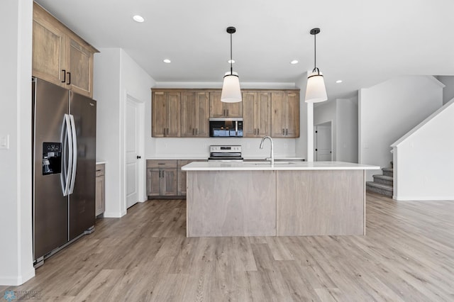3187 Archer Pl S, Fargo, ND 58104 - kitchen featuring stainless steel fridge with ice dispenser, electric range oven, a sink, light wood-style flooring, and light countertops