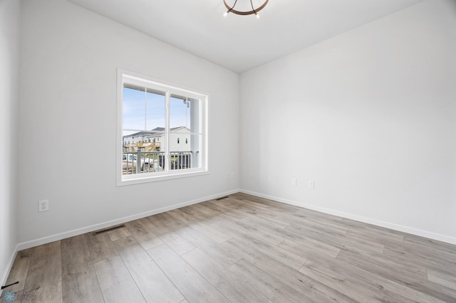 3187 Archer Pl S, Fargo, ND 58104 - unfurnished room featuring wood finished floors and baseboards
