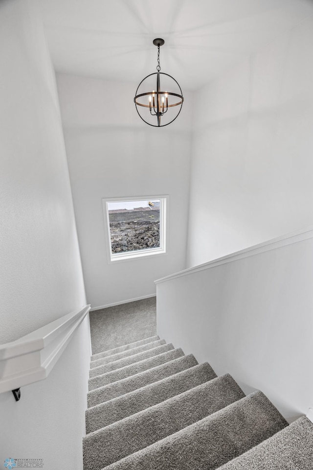3187 Archer Pl S, Fargo, ND 58104 - stairway featuring a chandelier and carpet flooring