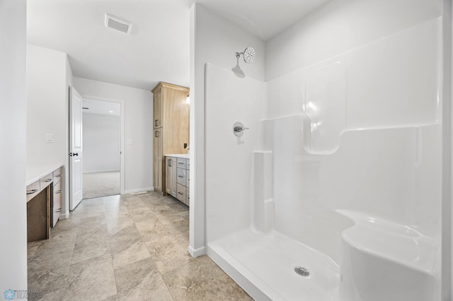 3187 Archer Pl S, Fargo, ND 58104 - full bathroom with vanity, a shower stall, and baseboards
