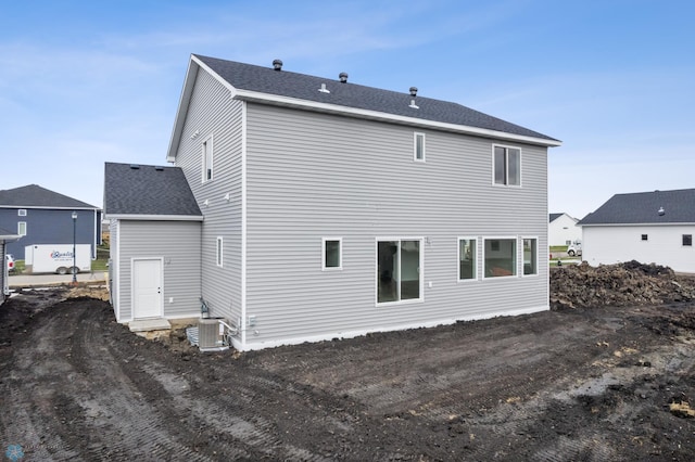 3187 Archer Pl S, Fargo, ND 58104 - rear view of property with cooling unit and roof with shingles