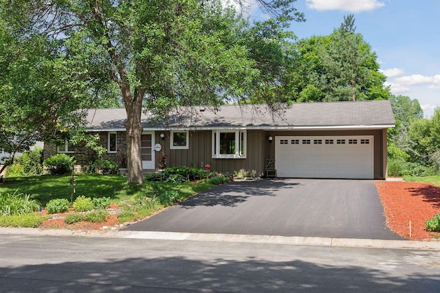1794 Karis Way, Eagan, MN 55122 - ranch-style house featuring asphalt driveway, a garage, board and batten siding, and a front yard
