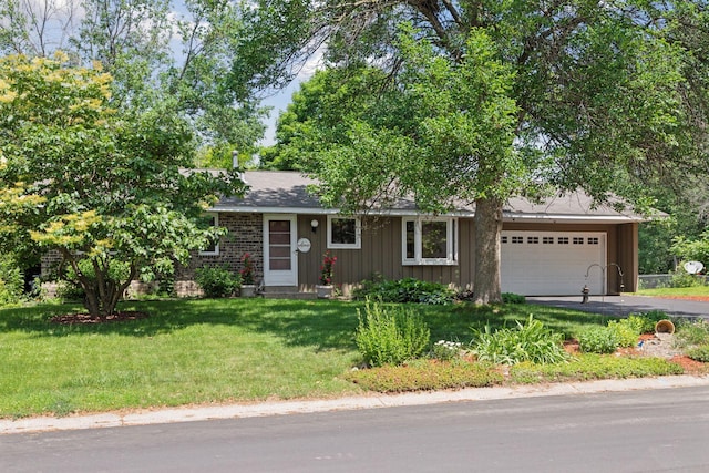 1794 Karis Way, Eagan, MN 55122 - view of front of house with driveway, an attached garage, a front yard, and board and batten siding