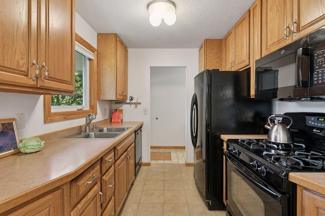 1794 Karis Way, Eagan, MN 55122 - kitchen featuring black appliances, a textured ceiling, light countertops, brown cabinetry, and light tile patterned floors