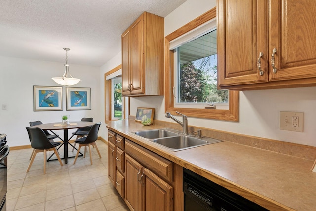 1794 Karis Way, Eagan, MN 55122 - kitchen with decorative light fixtures, light countertops, range, brown cabinets, and a textured ceiling