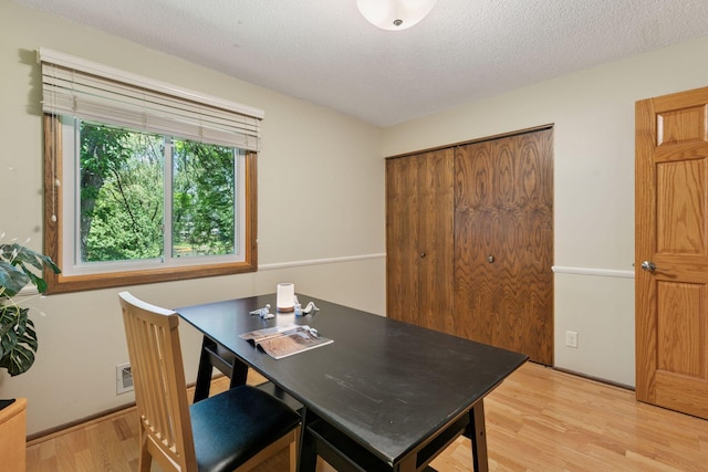 1794 Karis Way, Eagan, MN 55122 - dining area with light wood-style flooring and a textured ceiling