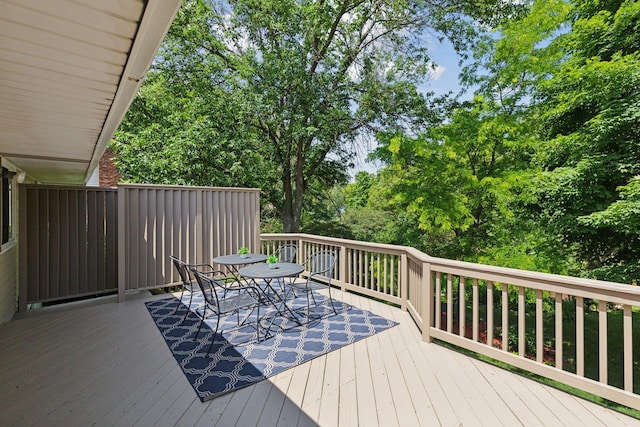 1794 Karis Way, Eagan, MN 55122 - wooden deck featuring outdoor dining space and view of scattered trees