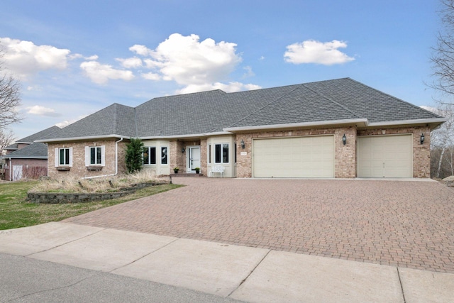 7604 Delaney Blvd, Edina, MN 55439 - single story home with brick siding, a shingled roof, decorative driveway, and an attached garage
