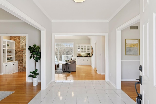7604 Delaney Blvd, Edina, MN 55439 - foyer featuring visible vents, light wood-type flooring, and ornamental molding