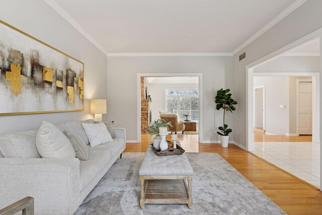 7604 Delaney Blvd, Edina, MN 55439 - living area featuring ornamental molding, visible vents, wood finished floors, and baseboards