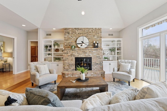 7604 Delaney Blvd, Edina, MN 55439 - living room featuring visible vents, vaulted ceiling, and wood finished floors