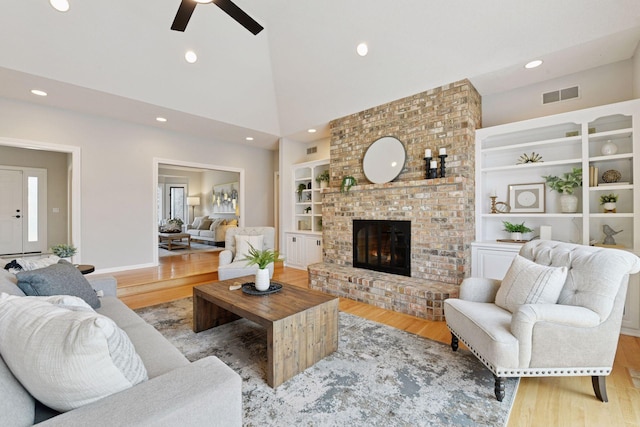 7604 Delaney Blvd, Edina, MN 55439 - living area featuring wood finished floors, visible vents, ceiling fan, and high vaulted ceiling
