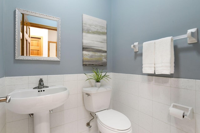 7604 Delaney Blvd, Edina, MN 55439 - bathroom featuring tile walls, wainscoting, and toilet